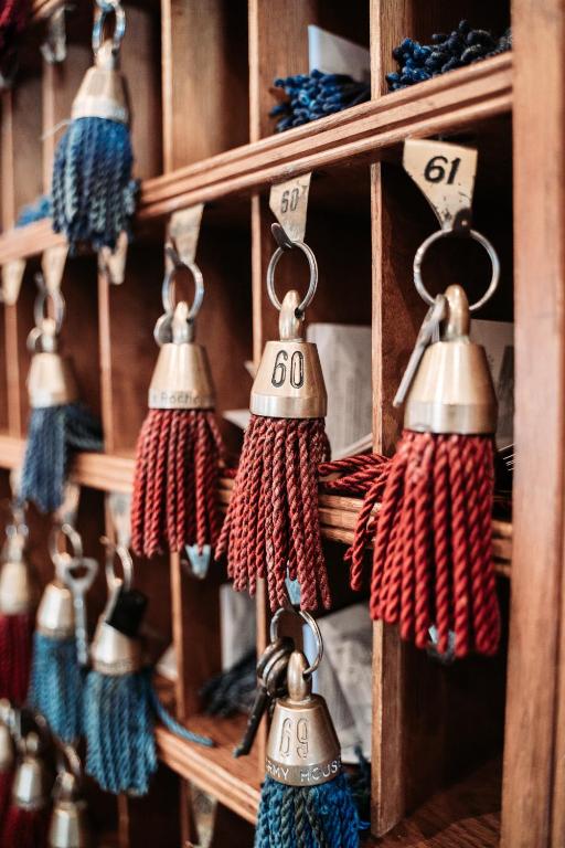 a bunch of tassels on a wooden shelf at Dormy House in Étretat