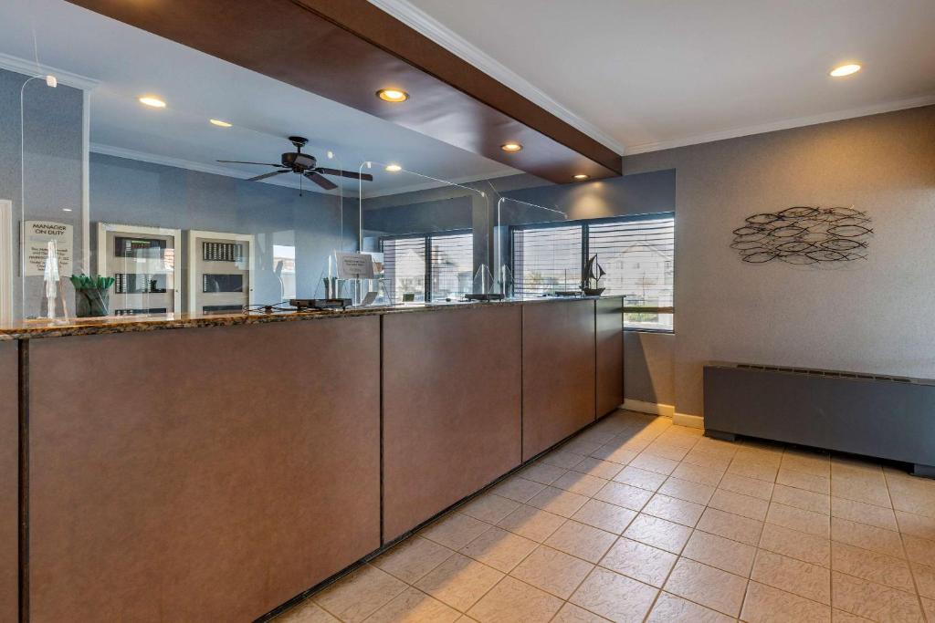 a large kitchen with a ceiling fan in a room at Quality Inn Boardwalk in Ocean City