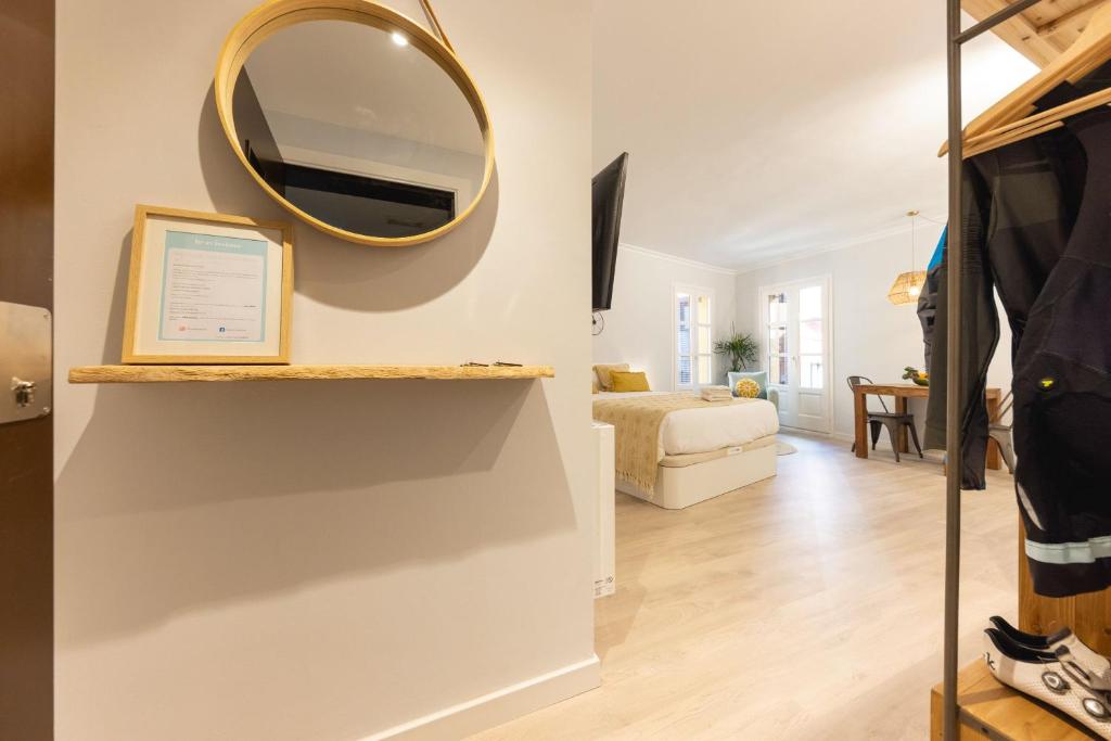 A television and/or entertainment centre at Bravissimo Barca Studio Dos