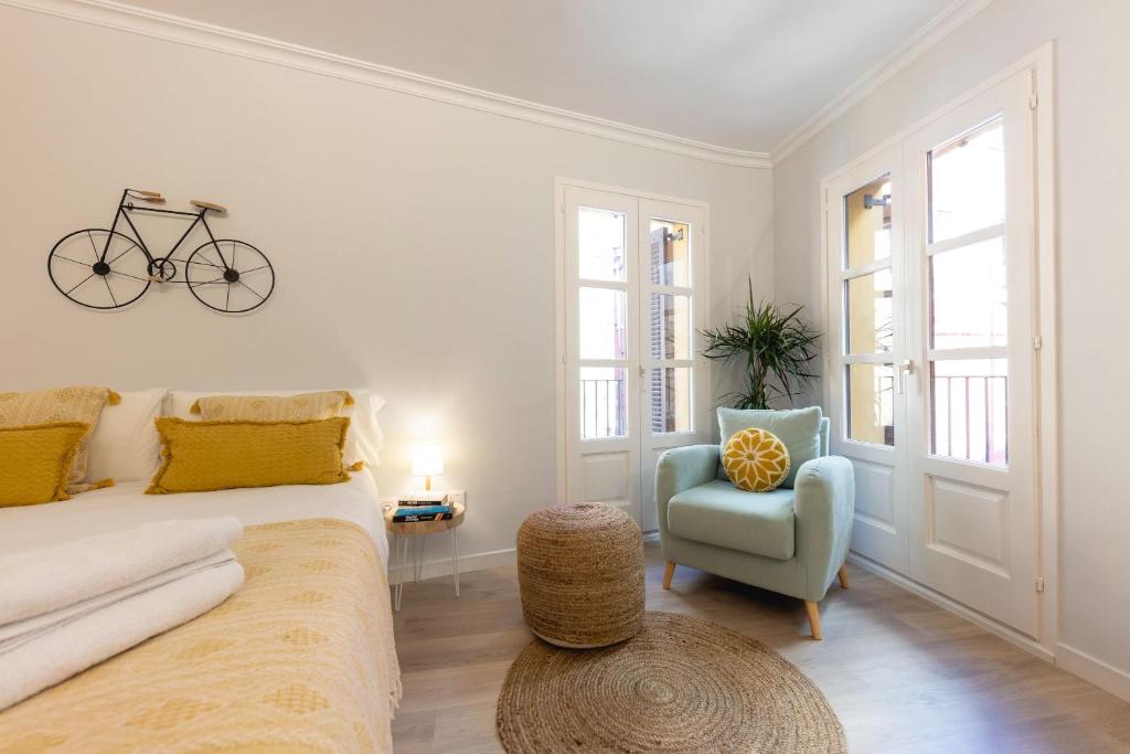 A seating area at Bravissimo Barca Studio Dos
