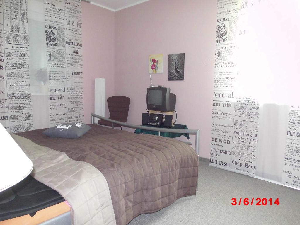 Ein Bett oder Betten in einem Zimmer der Unterkunft Pension Resi