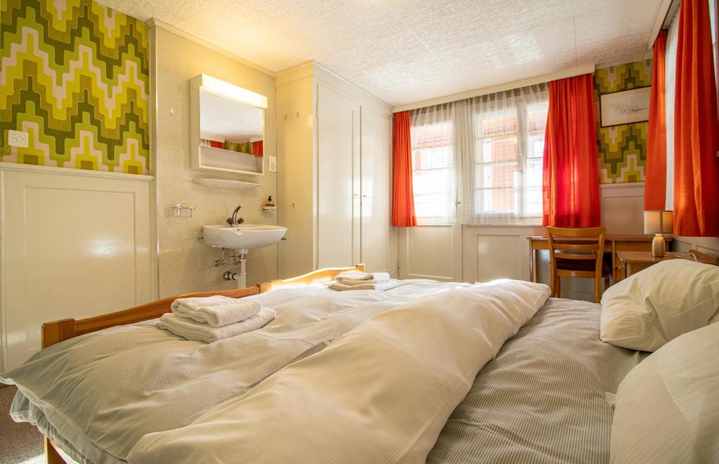 Postel nebo postele na pokoji v ubytování Chalet Methfessel by Arosa Holiday