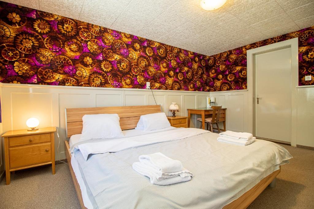 Postel nebo postele na pokoji v ubytování Chalet Methfessel by Arosa Holiday