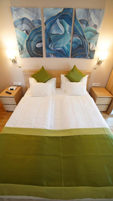 Posteľ alebo postele v izbe v ubytovaní Fenyves Apartmanok