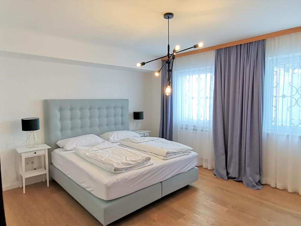 Postel nebo postele na pokoji v ubytování Rafael Kaiser Residence Privée - Spielberg Obdach
