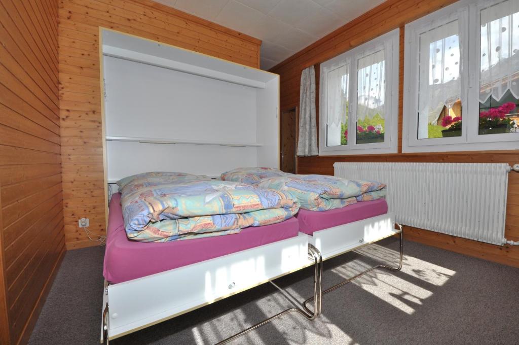 Postel nebo postele na pokoji v ubytování Chalet Ideal Saas-Fee
