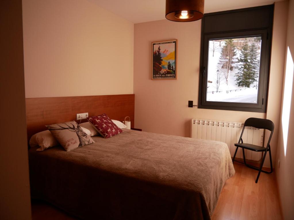 Postel nebo postele na pokoji v ubytování Solana-El Tarter