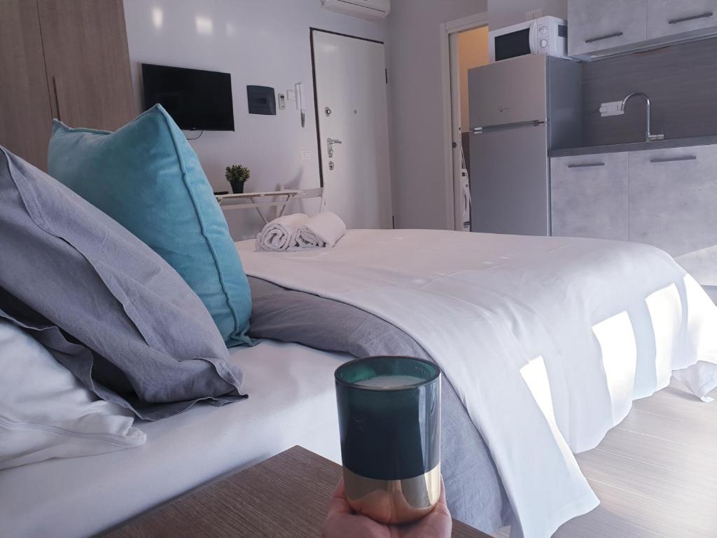 Postel nebo postele na pokoji v ubytování Michelangelo Apartments con parcheggio gratuito in loco e self check in