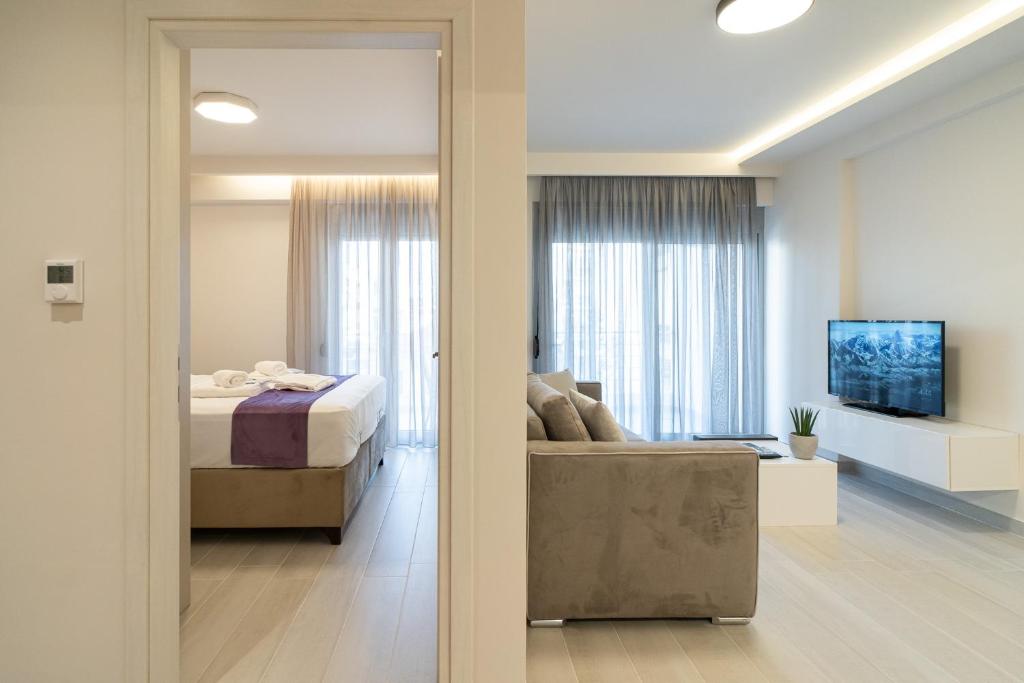 Postel nebo postele na pokoji v ubytování Petit Palace Trikala