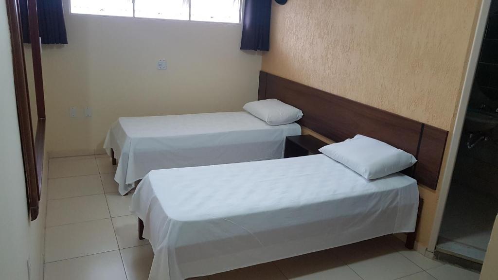 Postel nebo postele na pokoji v ubytování Sleep Suites