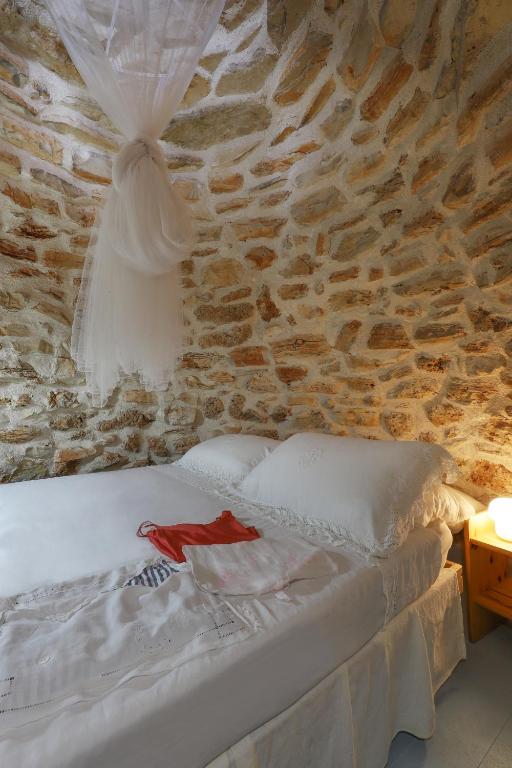 Postel nebo postele na pokoji v ubytování Antico Trullo Salentino