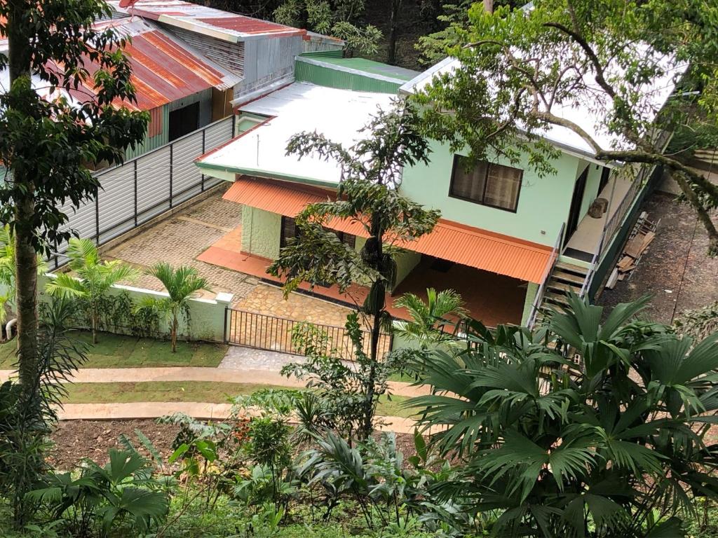 an overhead view of a house with an orange roof at Casa Encantada offers you Two-Bedroom House, 1 Tiny Apartment & 3 Double Rooms in Manuel Antonio