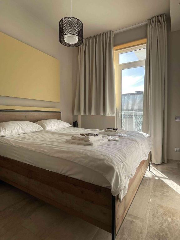 Posteľ alebo postele v izbe v ubytovaní WUKELA APARTMENTS