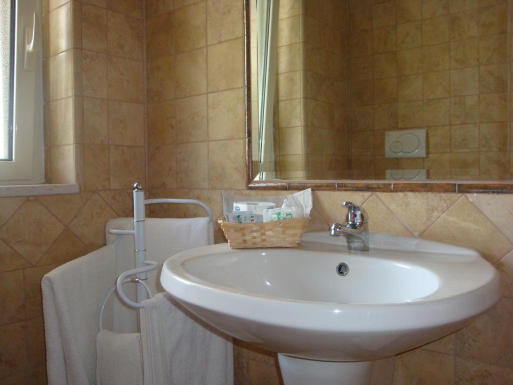 Koupelna v ubytování Hotel Maggiore