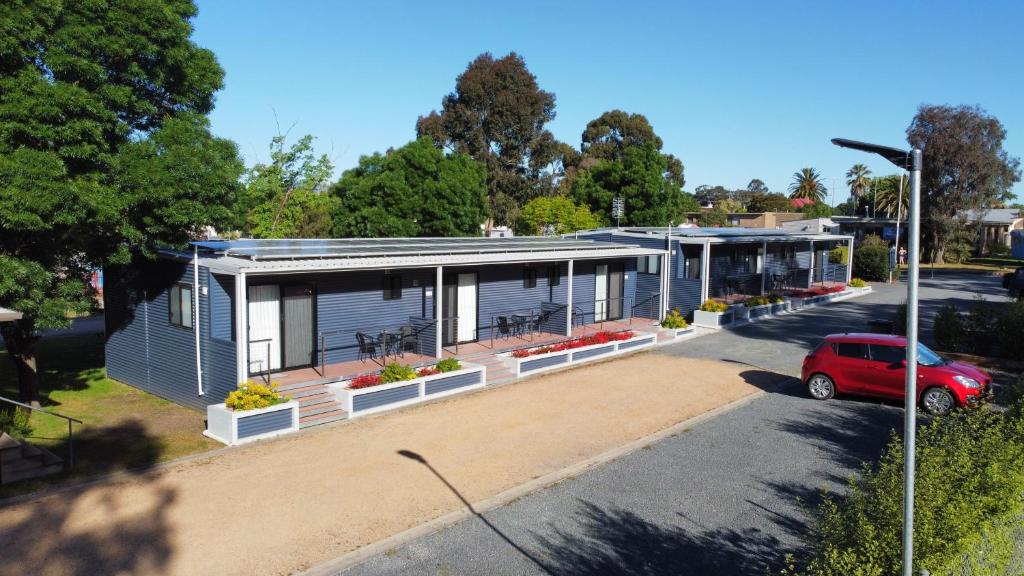 a large white building with a lot of windows at Acacia Caravan Park & Holiday Units in Ararat