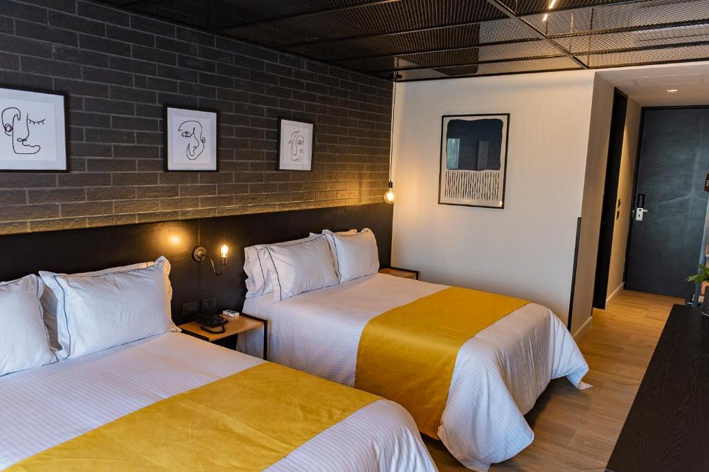 Postel nebo postele na pokoji v ubytování FULTON Business Luxury HOTEL