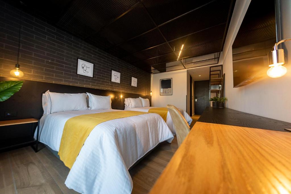 Postel nebo postele na pokoji v ubytování FULTON Business Luxury HOTEL