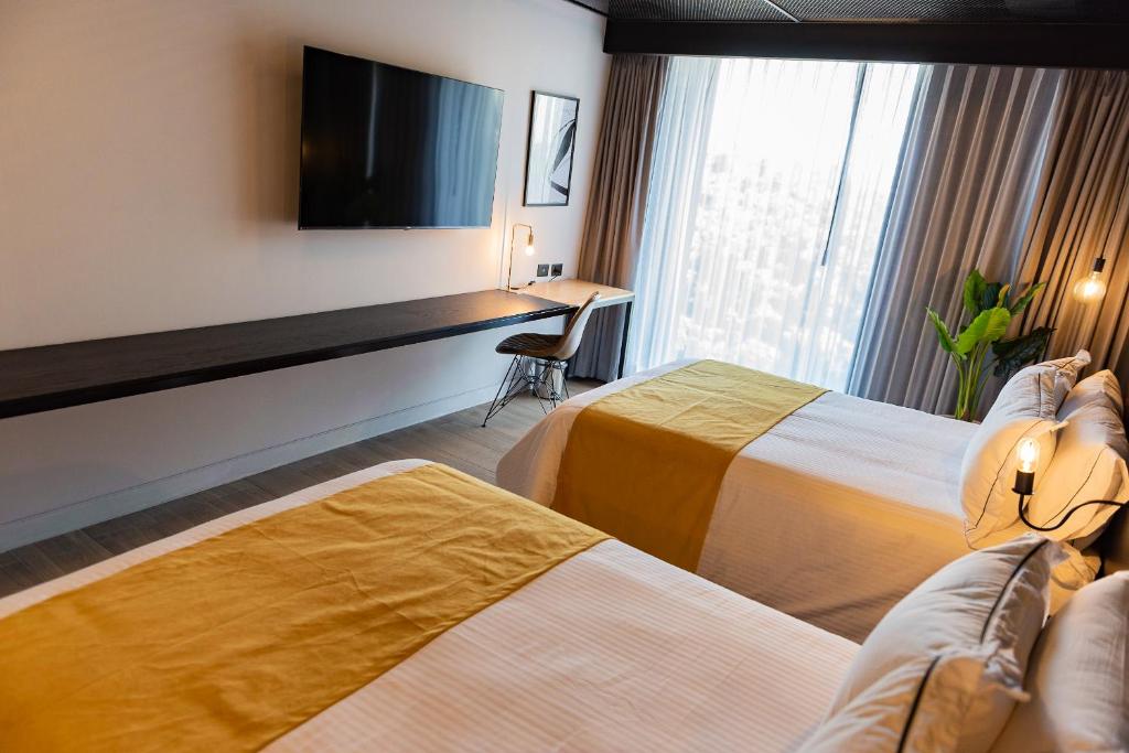 Postel nebo postele na pokoji v ubytování FULTON Business Luxury HOTEL