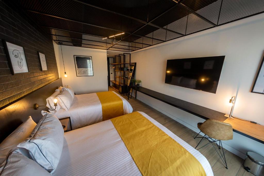 Postel nebo postele na pokoji v ubytování FULTON Business Luxury HOTEL