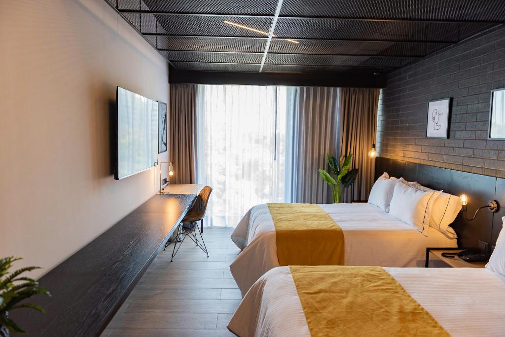 Postel nebo postele na pokoji v ubytování FULTON Business Luxury HOTEL