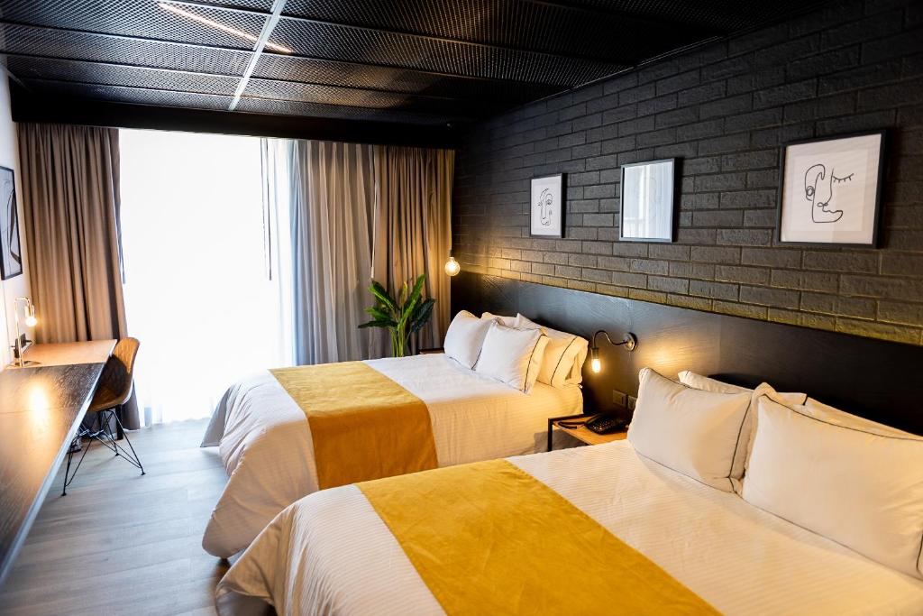 Postel nebo postele na pokoji v ubytování FULTON Business Luxury HOTEL