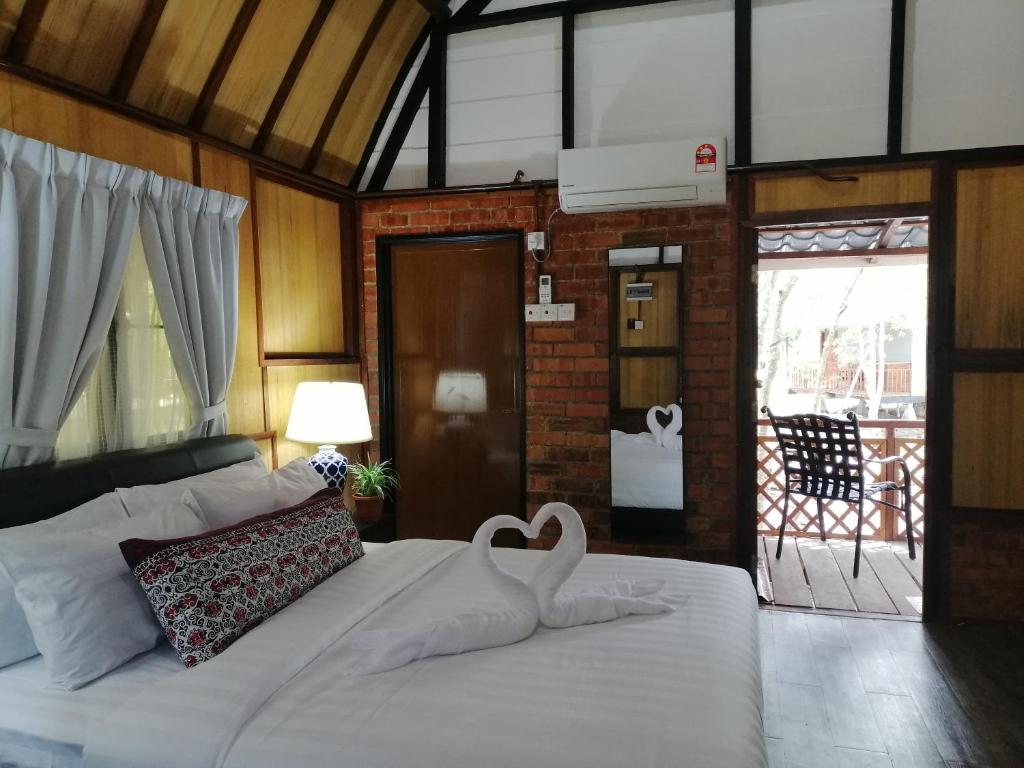 Postel nebo postele na pokoji v ubytování Api-api Eco Chalet