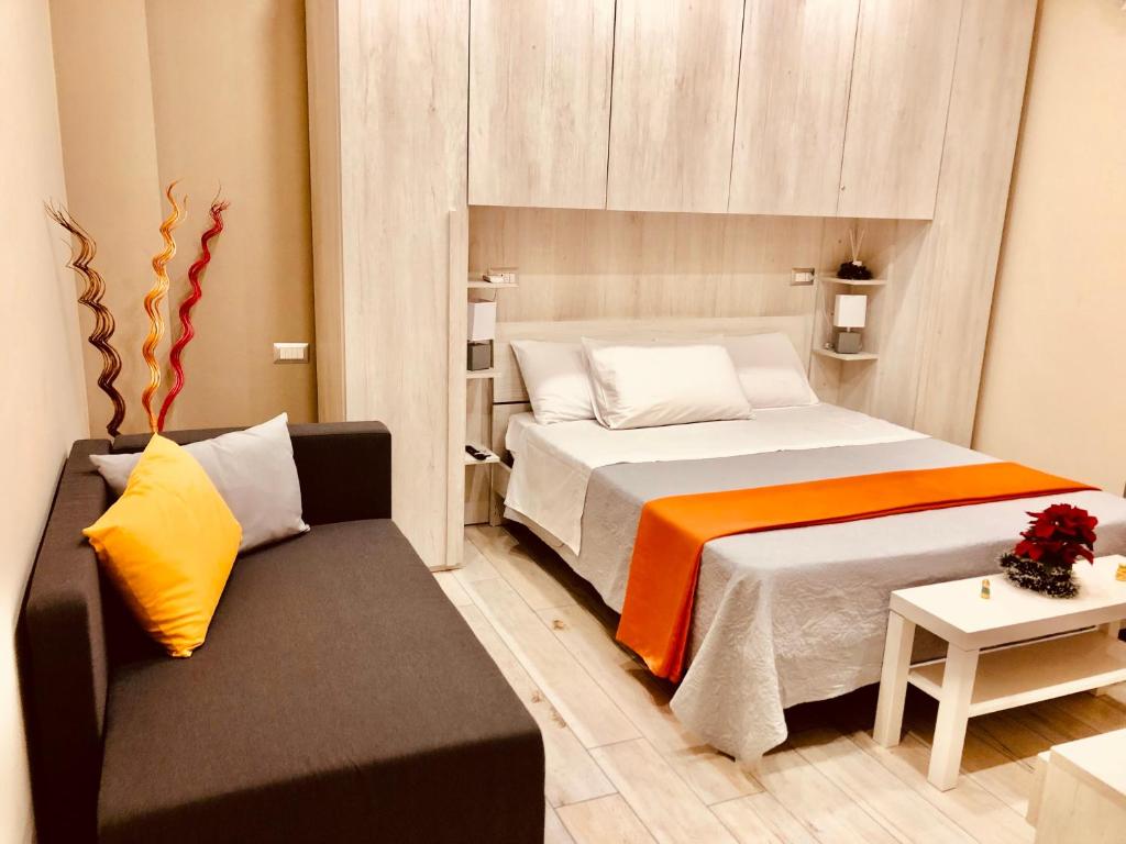 Postel nebo postele na pokoji v ubytování YourHome - La Meta Perfetta Rooms&Spa