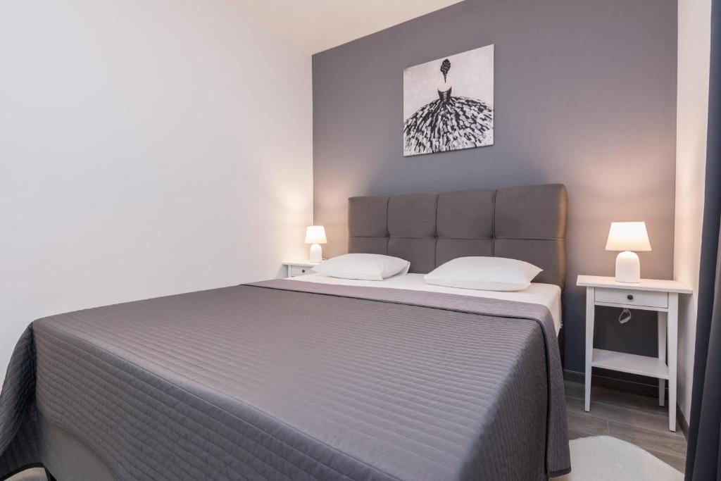 מיטה או מיטות בחדר ב-Apartments Star