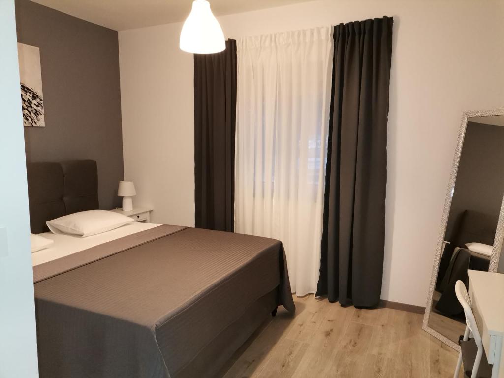 Posteľ alebo postele v izbe v ubytovaní Apartments Star - free private parking