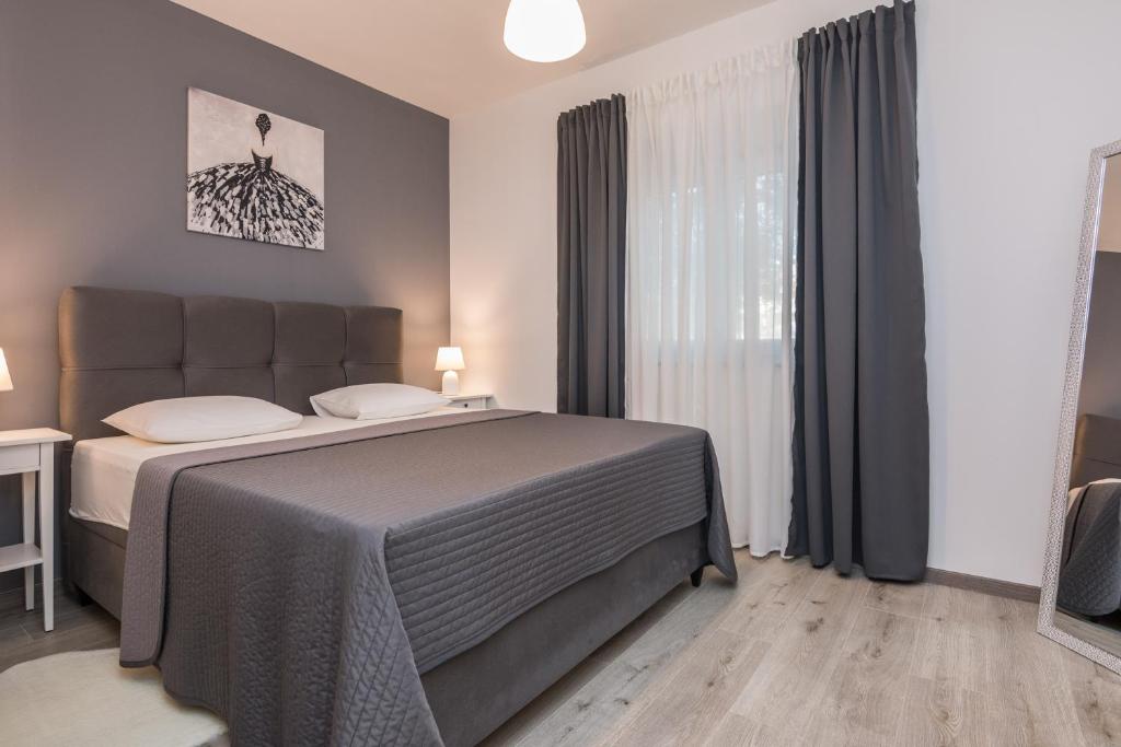 Posteľ alebo postele v izbe v ubytovaní Apartments Star - free private parking