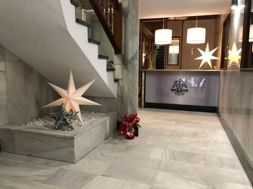 a lobby with christmas decorations and a staircase at Hotel Océano Centro in Santa Cruz de Tenerife