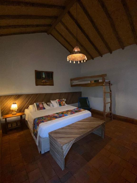 Postel nebo postele na pokoji v ubytování Vilarejo Macapá Chalés