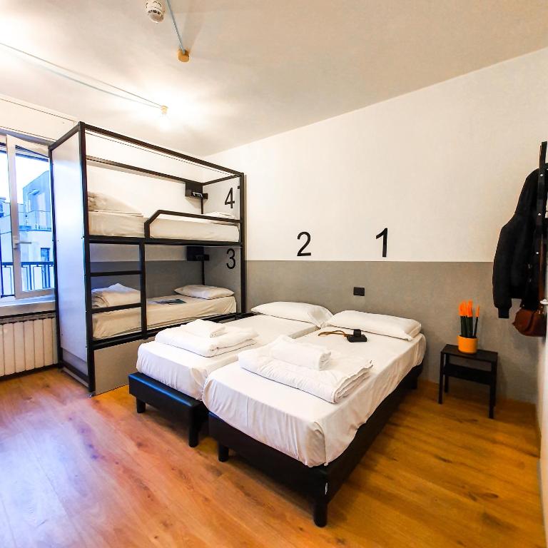Postel nebo postele na pokoji v ubytování Hotello Hostel