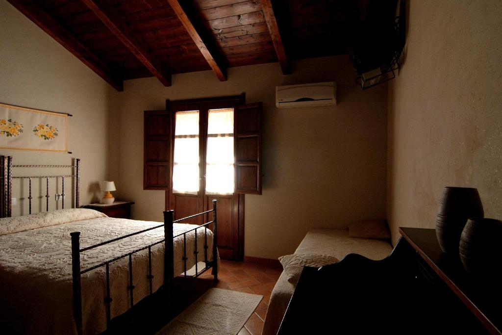 A bed or beds in a room at Il Quinto Moro
