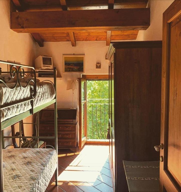 Posteľ alebo postele v izbe v ubytovaní Agriturismo i Gessi