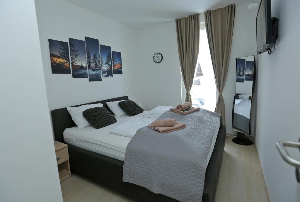 Ένα ή περισσότερα κρεβάτια σε δωμάτιο στο NEST Apartment
