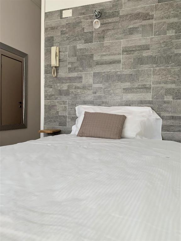 Postel nebo postele na pokoji v ubytování Albergo Moderno