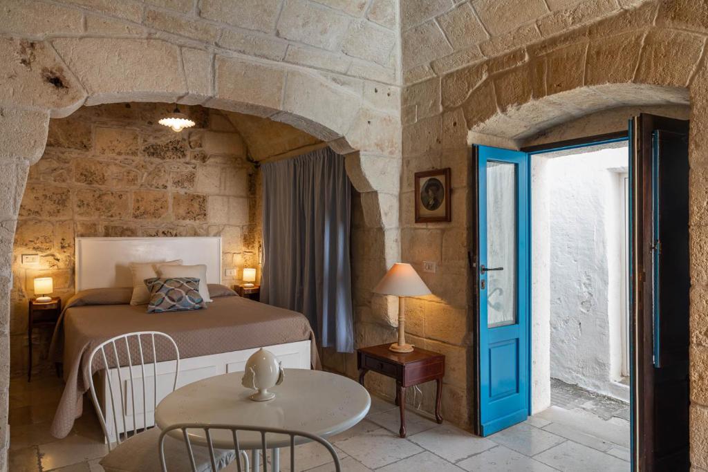Postel nebo postele na pokoji v ubytování Albergo Diffuso Monopoli