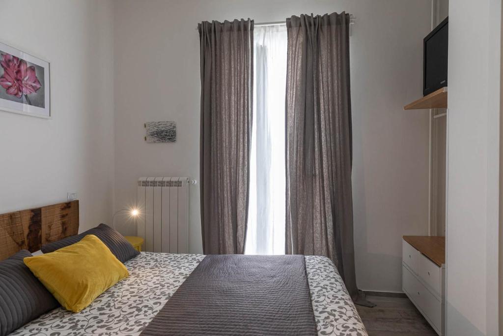 Postel nebo postele na pokoji v ubytování Albergo Diffuso Monopoli
