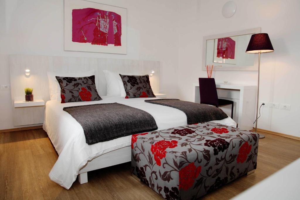 Voodi või voodid majutusasutuse Boutique Hotel Dvor toas