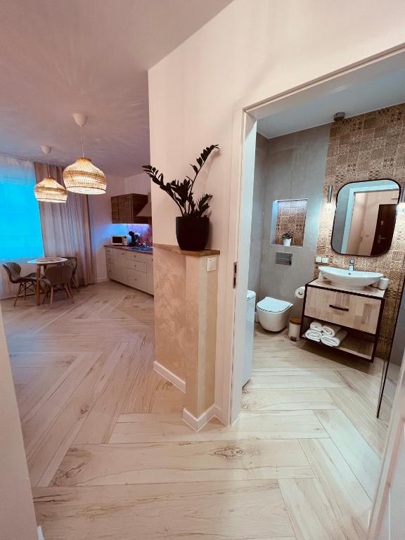 Televízia a/alebo spoločenská miestnosť v ubytovaní Sunset Apart