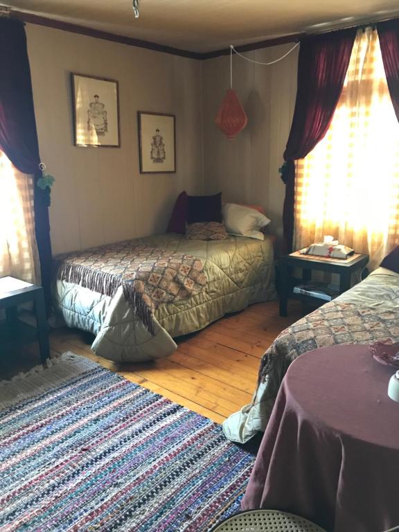 Postel nebo postele na pokoji v ubytování Gîte au Toit Bleu