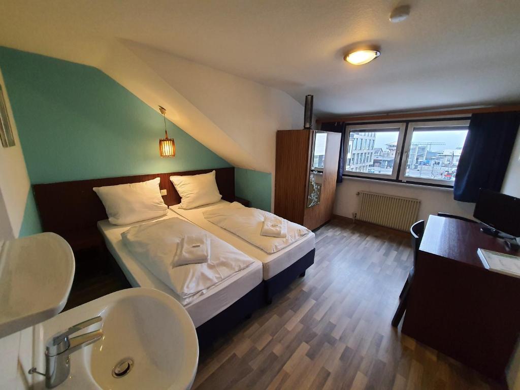 Postel nebo postele na pokoji v ubytování Hotel Pension Graf