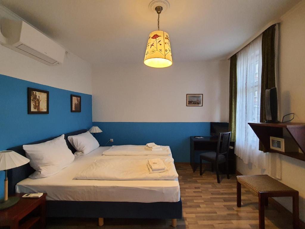 Postel nebo postele na pokoji v ubytování Hotel Pension Graf