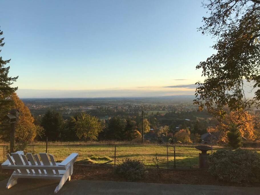 a white bench sitting on top of a hill at Spectacular Valley View in Wine Country in Newberg