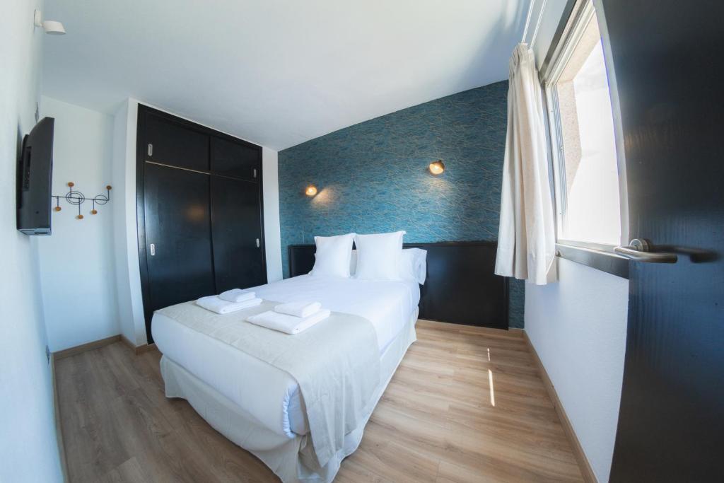 Posteľ alebo postele v izbe v ubytovaní Hotel Ventus
