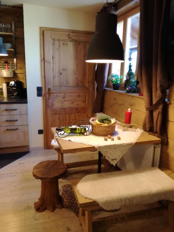 a kitchen with a table with a bowl of food on it at LES CHALET Kranjska Gora I in Kranjska Gora