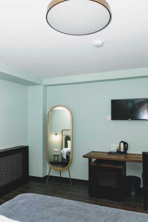 Postel nebo postele na pokoji v ubytování Paliani Hotel