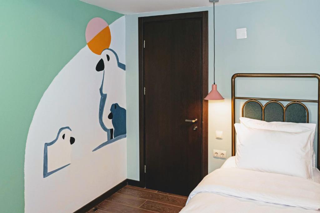 Postel nebo postele na pokoji v ubytování Paliani Hotel