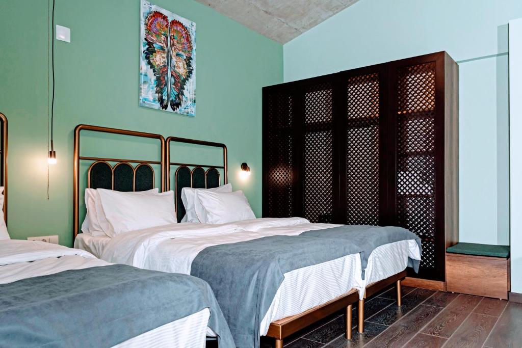 Postel nebo postele na pokoji v ubytování Paliani Hotel